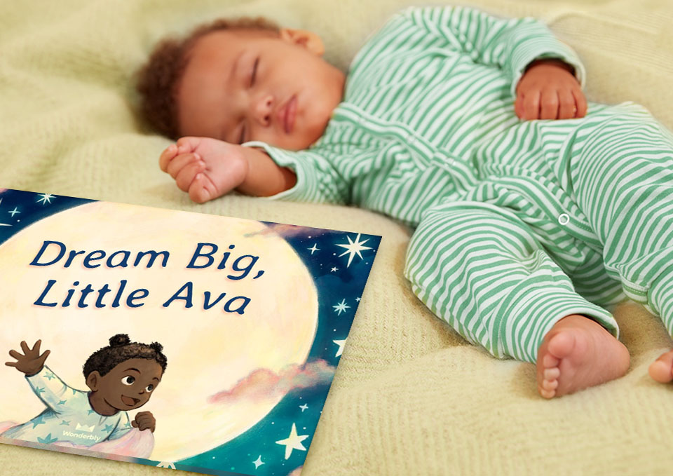 Asleep baby with Dream Big Little One book