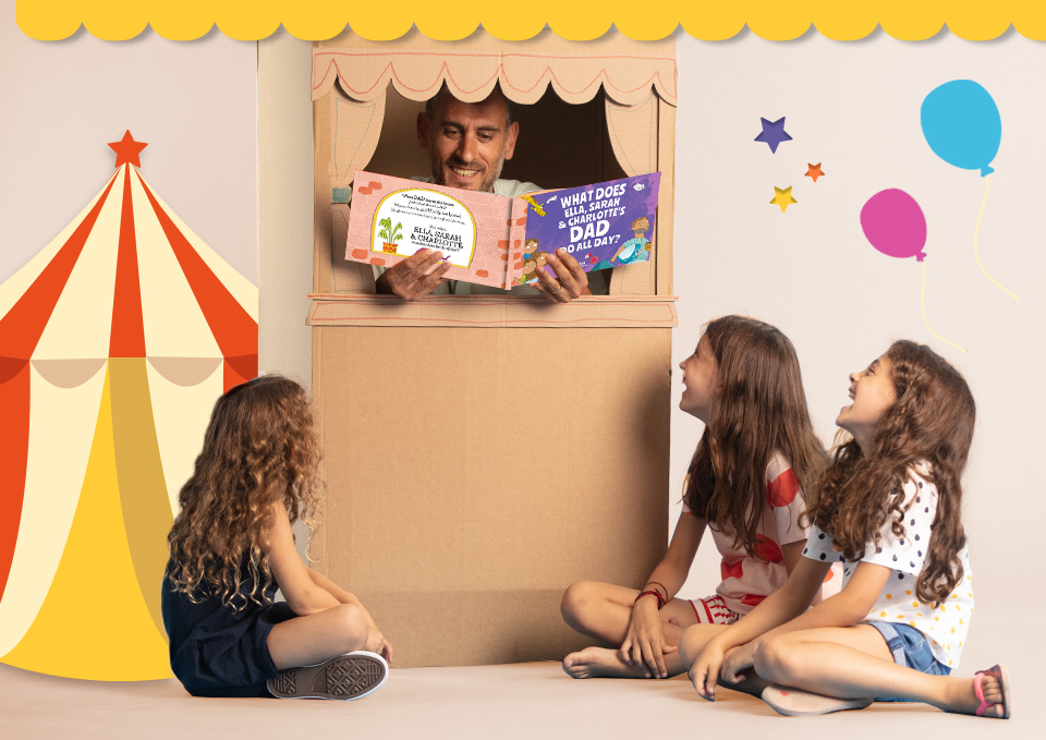 Dad reading a personalised Wonderbly book to his three daughters