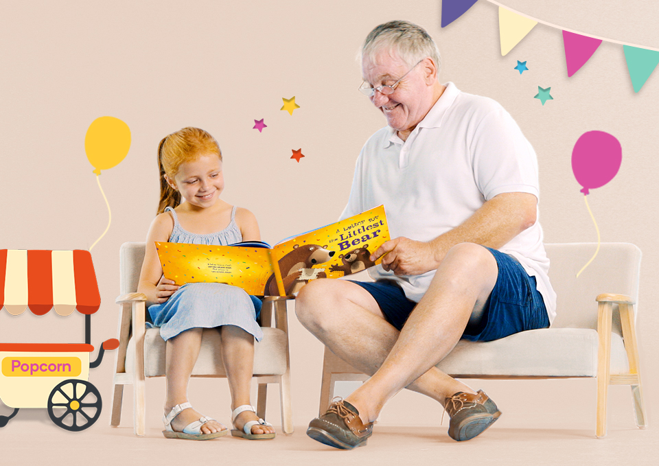 Grandpa reading a personalised Wonderbly book to his granddaughter 