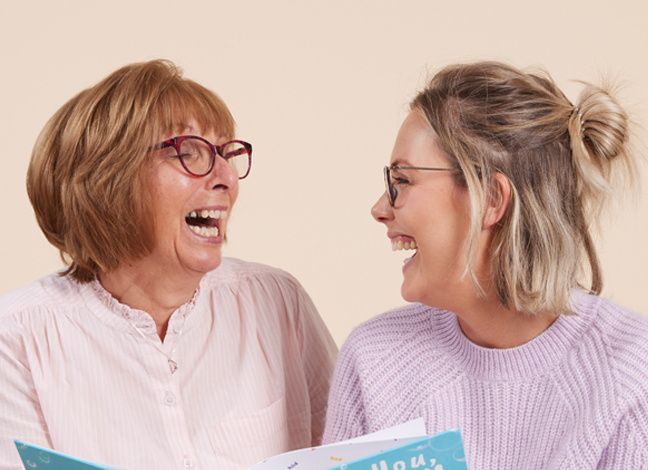 Mum and daughter reading a personalised book 