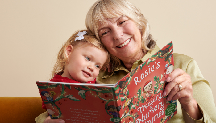 Grandma and granddaughter reading a personalised nursery rhymes book